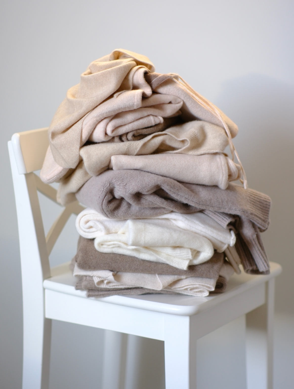 Folded knitwear in neutral tones